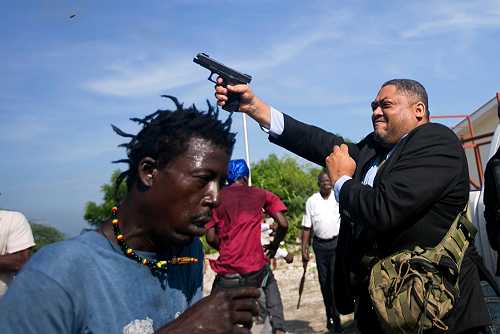 Haitian senator shoots Associated Press journalist and security guard during protest - theGrio